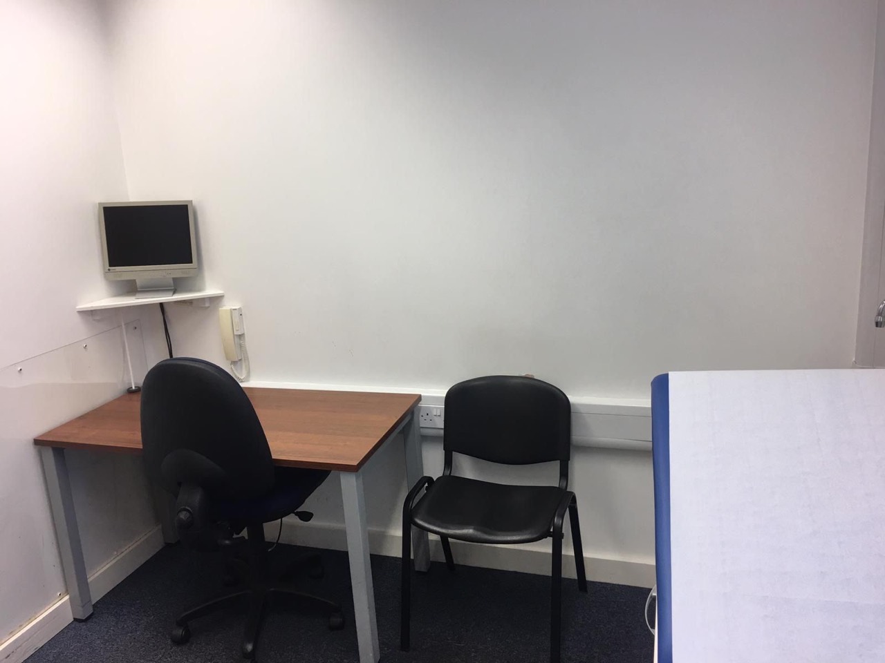 Private medical consulting room to rent in Bradford with desk, seating and clinical phone point