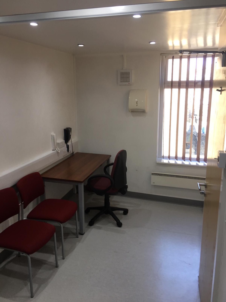 Clinic room to rent in Bradford with desk, seating and large window